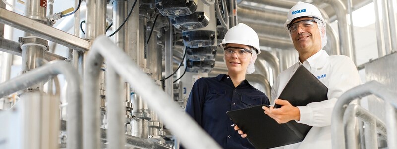 An Ecolab associate with a customer during an on-site consultation