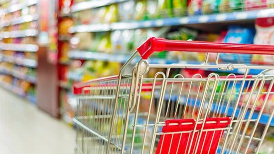 Shopping chart in a grocery aisle.